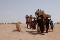 Newly arrived refugees fleeing fighting in Darfur arrive at the border between Sudan and Chad on April 22, 2024 in Adre, Chad