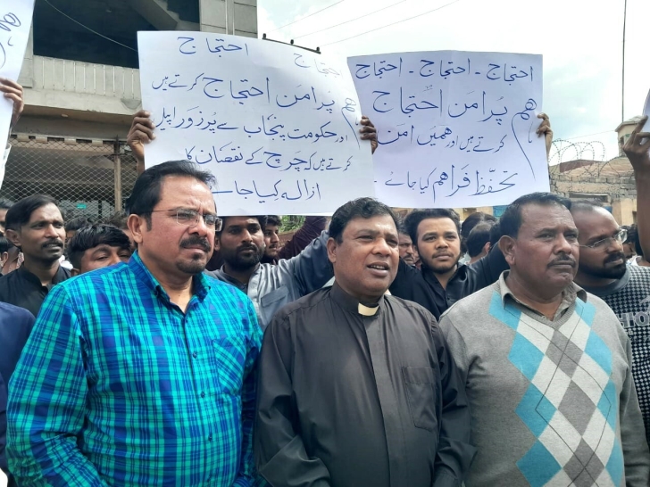 The Rev. Adeem Alphonse (c) and others demand justice after fire at church building in Gujar Khan, Rawalpindi District, Pakistan on March 30, 2024.
