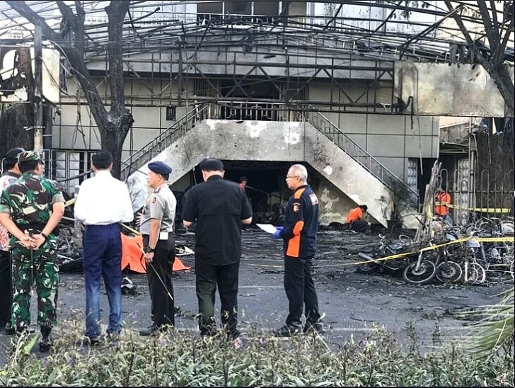 Indonesian President Joko Widodo (in white) at one of the church buildings attacked by terrorists in May 2018.
