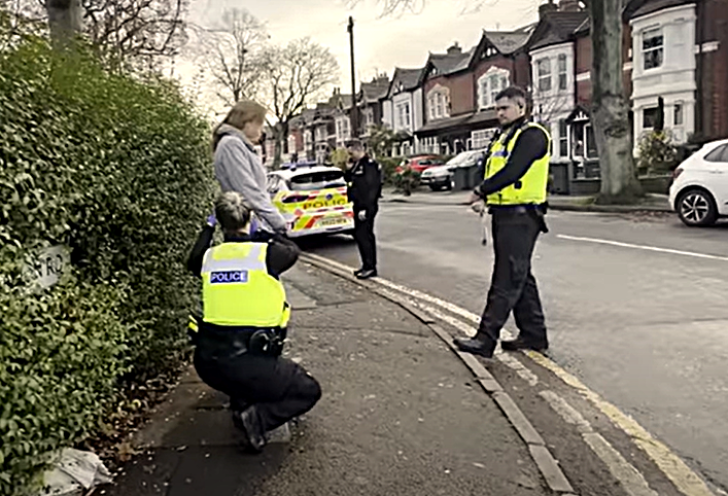 Isabel Vaughan-Spruce being searched during arrest for praying silently outside an abortion facility.