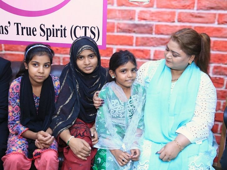 Rescued sisters with Christians True Spirit Executive Director Katherine Sapna.