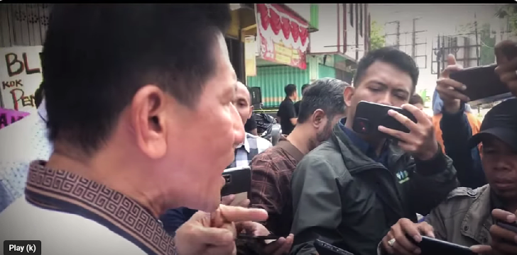 Pastor Herri Soesanto objects to manhandling at sealing of church in Mojongapit, East Java Province, Indonesia. 