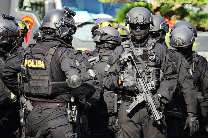 A team from Densus 88, an elite counter-terrorism force, prior to an operation in Indonesia.