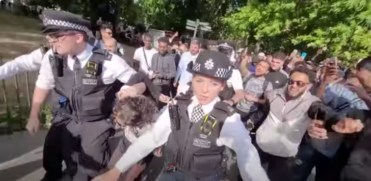 U.K. police take Christian evangelist Hatun Tash into custody on June 26, 2022.