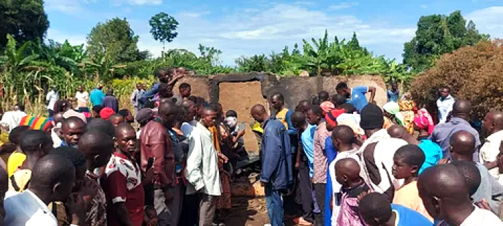 Villagers at charred home where Pastor Mukisa and family were burned to death in Namutumba District, Uganda on Oct. 13, 2024.