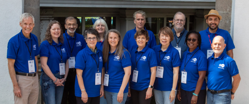 John Maust (far left) stepped back from MAI after 26 years and handed over the association's leadership to Heather Pubols (6th from the left).
