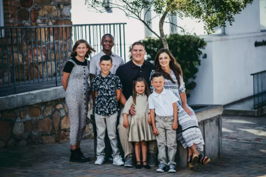 Josh Sullivan (C) and his family in South Africa.