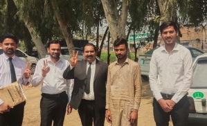 Chand Shamaun (in tan clothes) with attorneys after acquittal of false blasphemy charges on May 10, 2025 in Pakistan.