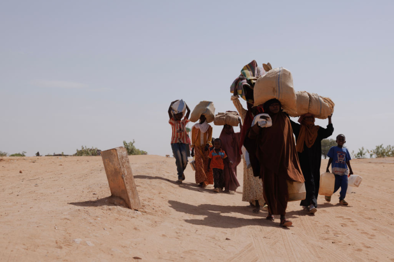 Newly arrived refugees fleeing fighting in Darfur arrive at the border between Sudan and Chad on April 22, 2024 in Adre, Chad