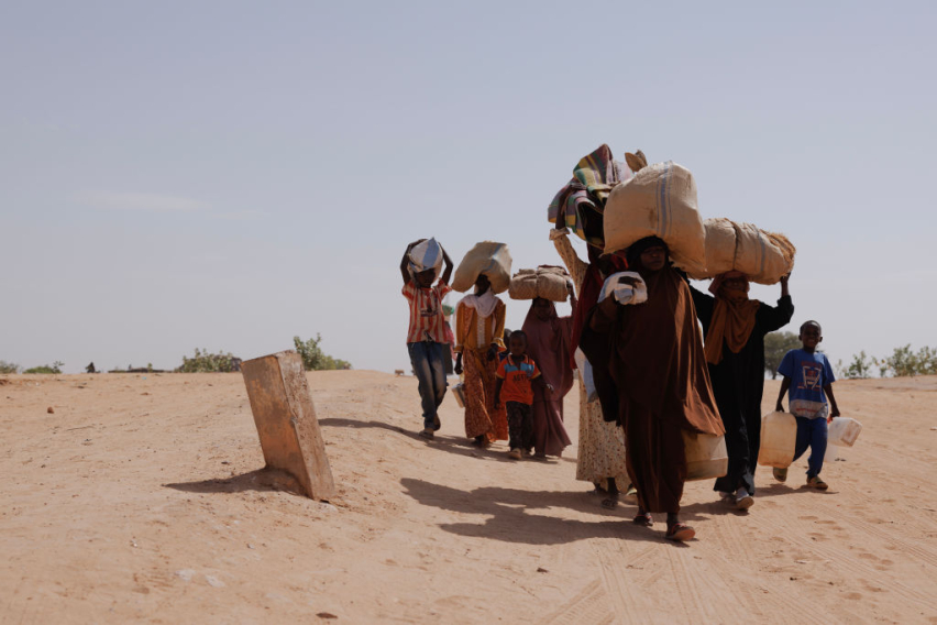 Newly arrived refugees fleeing fighting in Darfur arrive at the border between Sudan and Chad on April 22, 2024 in Adre, Chad