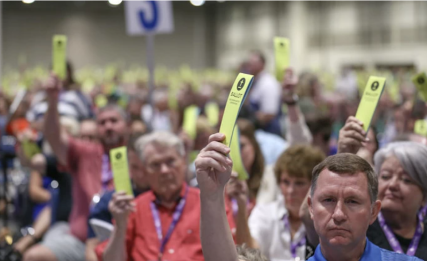 Messengers hold up ballot cards