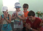 Alexei Yuditsenko, Mission Eurasia’s School Without Walls (SWW) coordinator in Berdyansk, praying with children in Ukraine.