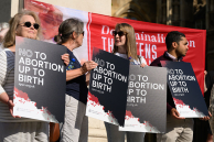 LONDON, ENGLAND - JUNE 17: Supporters of the pro-life group The Society for the Protection of Unborn Children (SPUC) demonstrate against the the proposed decriminalisation of abortion, outside the Houses of Parliament on June 17, 2025 in London, England