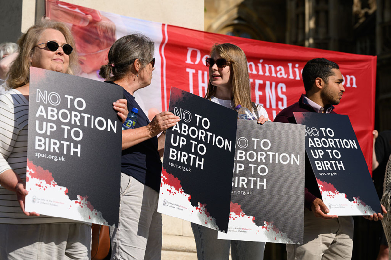 LONDON, ENGLAND - JUNE 17: Supporters of the pro-life group The Society for the Protection of Unborn Children (SPUC) demonstrate against the the proposed decriminalisation of abortion, outside the Houses of Parliament on June 17, 2025 in London, England