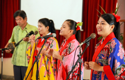 A Japanese-Peruvian family sings during a worship at a Japanese church in Peru.
