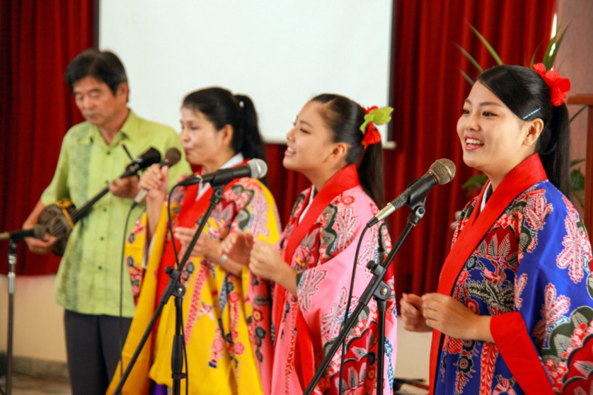 A Japanese-Peruvian family sings during a worship at a Japanese church in Peru.