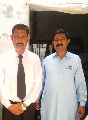 Attorney Hanif Hameed (L) with rape victim’s father, Razzaq Masih, after court verdict on July 9, 2025.