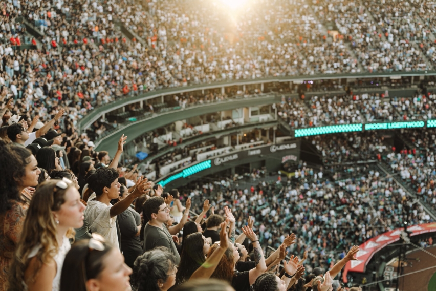 A packed Angel Stadium crowd worships together during the 2025 Harvest Crusade in Anaheim, where more than 45,000 gathered for music, prayer, and a gospel message from Pastor Greg Laurie.
