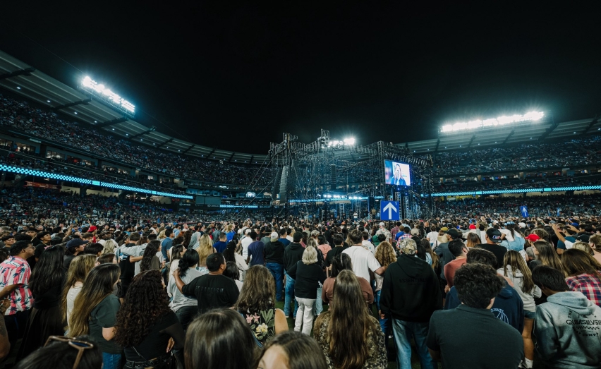 Hundreds stand on the field at Angel Stadium responding to the invitation to follow Christ during the 2025 Harvest Crusade, as thousands more look on in a powerful moment of faith and worship.