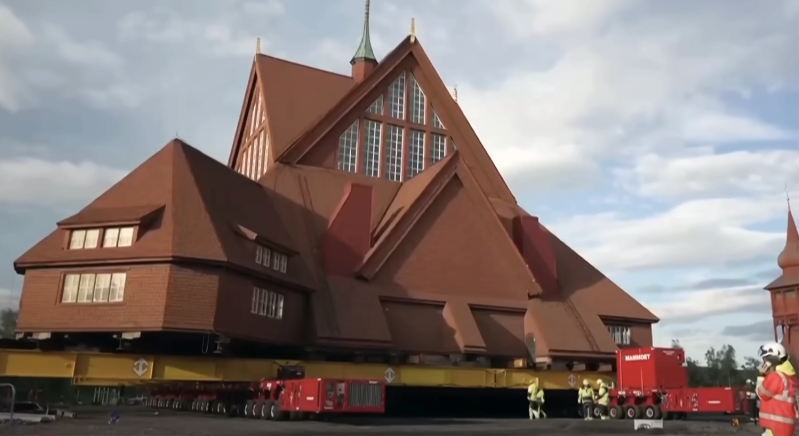 Workers use massive trailers to relocate the 113-year-old Kiruna Church in northern Sweden during a two-day move to protect it from ground subsidence caused by iron ore mining.