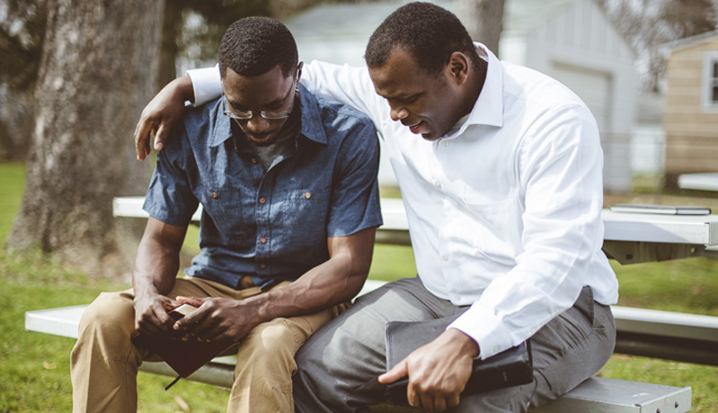 African men praying