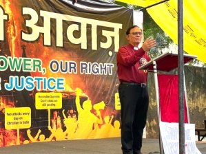 The Rev. Richard Howell addresses rally against persecution of Christians in Jantar Mantar, New Delhi on Aug. 22, 2025.