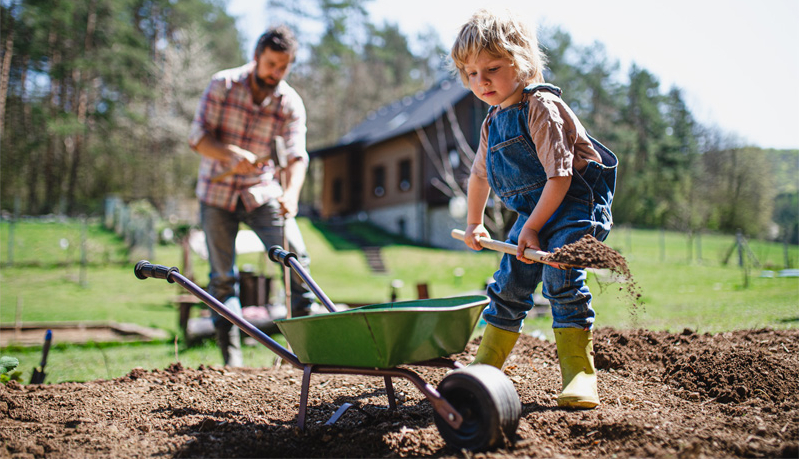 Child working alongside dad