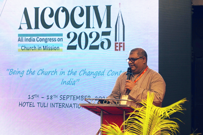 Vijayesh Lal, General Secretary of the Evangelical Fellowship of India, welcomes nearly 450 participants to the opening session of AICOCIM 2025, calling the gathering a “kairos moment” for the Indian Church.