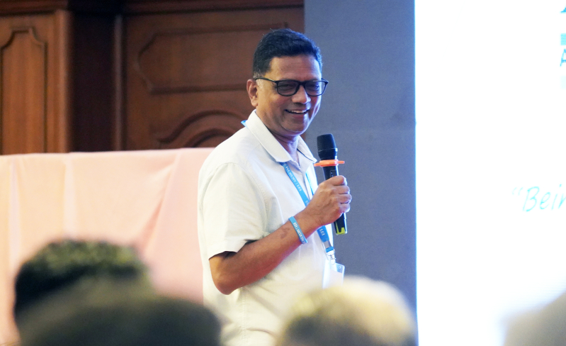 Rev. Dr. Praveen Paul, Principal of Caleb Institute, speaks at AICOCIM on Sept. 15, 2025