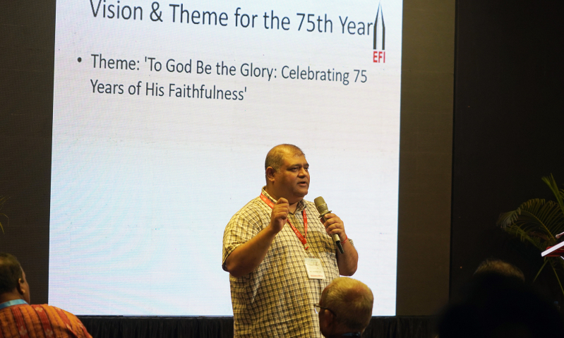 Rev. Vijayesh Lal, General Secretary of the Evangelical Fellowship of India, introduces the theme “To God be the glory” as EFI launches its 75th anniversary celebrations at AICOCIM in New Delhi, Sept. 17, 2025.
