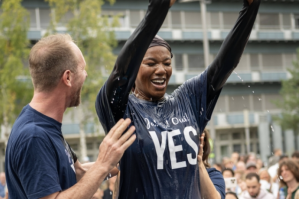A participant is baptized under the open sky at Turbinenplatz in Zurich during the joint worship service of 13 churches on Switzerland’s Federal Day of Thanksgiving, Repentance and Prayer.