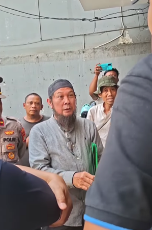 Muslims protest at site of church in commercial complex in Gerendeng Pulo village, Tangerang, Indonesia.