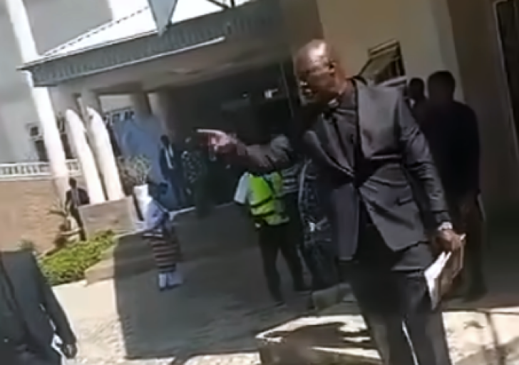 Screenshot from a video posted by Jay FM shows a Church of Christ in Nations (COCIN) leader following the dispute outside the church headquarters in Jos during the funeral service.