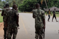 Soldiers patrols through a village in Mozambique, where years of conflict and extremist violence have left communities vulnerable and displaced.