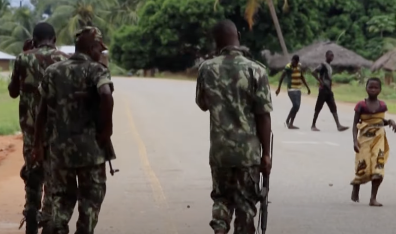Soldiers patrols through a village in Mozambique, where years of conflict and extremist violence have left communities vulnerable and displaced.