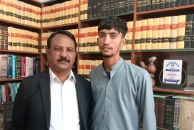 Rahul Masih with attorney Lazar Allah Rakha after winning correction of his name and Christian faith on his national ID.