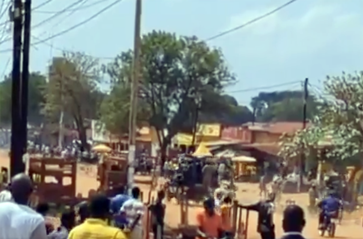 Police officers arrive at the scene in Yumbe town, Northern Uganda, on Nov. 4, after clashes erupted between Muslim and Christian residents over plans to open a pork outlet. The district, where about 76% of residents are Muslim, has a history of religious