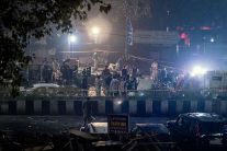 Police and emergency teams work at the blast site on November 10, 2025 in Delhi, India.