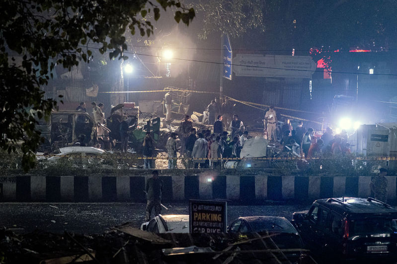 Police and emergency teams work at the blast site on November 10, 2025 in Delhi, India.