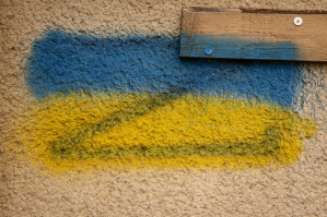 SNIHURIVKA, UKRAINE - NOVEMBER 23, 2022: The Ukrainian flag colors are seen painted over the Russian forces Z logo at a cultural center that was used as a base by Russian forces during their occupation of the town on November 23, 2022 in Snihurivka, Ukr