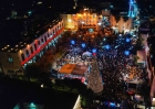 An aerial view of Bethlehem’s Manger Square shows large crowds gathered around the illuminated Christmas tree during the city’s first public celebration in two years.