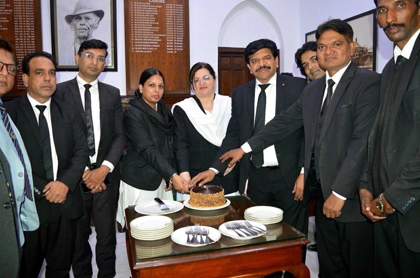 Lahore High Court Chief Justice Aalia Neelum cuts a cake with Christian lawyers during a Christmas observance at the Lahore High Court on Dec. 14, 2025.