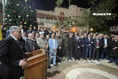 Residents and church leaders relight the Christmas tree at the Latin Monastery Church in Jenin, West Bank, on Dec. 24, 2025, two days after an arson attack.