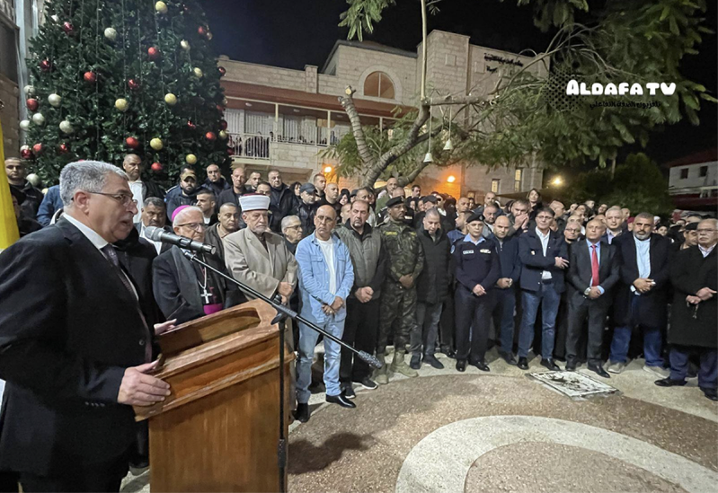 Residents and church leaders relight the Christmas tree at the Latin Monastery Church in Jenin, West Bank, on Dec. 24, 2025, two days after an arson attack.