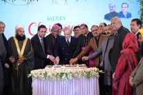 Prime Minister Shehbaz Sharif cuts the Christmas cake with Christian leaders and government officials at a special ceremony held at the PMs House on Dec 25, 2025.