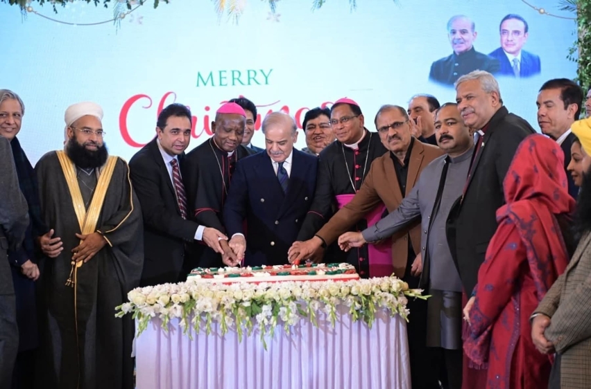 Pakistans Chief of Defense Forces Field Marshal Asim Munir cuts a Christmas cake with Church of Pakistans Bishop of Lahore Diocese Nadeem Kamran during the special mass on Dec. 25, 2025.