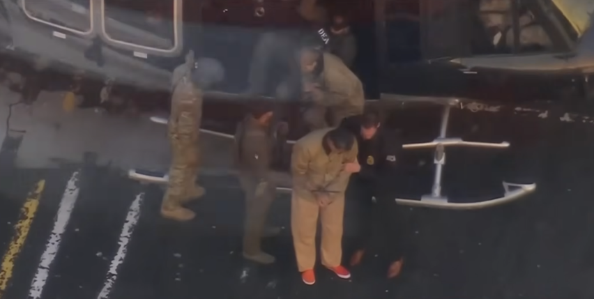Venezuelan President Nicolás Maduro exits a helicopter under heavy security upon arrival in New York, where he is expected to face federal drug-trafficking and narco-terrorism charges following his capture in a U.S. operation.