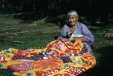 A woman works on a tivaivai, a traditional hand-stitched quilt, an art form discussed in a recent All Things Reconciled podcast episode exploring how Indigenous creative practices can foster healing, cultural identity and reconciliation.