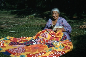 A woman works on a tivaivai, a traditional hand-stitched quilt, an art form discussed in a recent All Things Reconciled podcast episode exploring how Indigenous creative practices can foster healing, cultural identity and reconciliation.