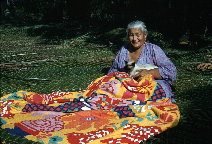 A woman works on a tivaivai, a traditional hand-stitched quilt, an art form discussed in a recent All Things Reconciled podcast episode exploring how Indigenous creative practices can foster healing, cultural identity and reconciliation.
